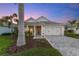 Attractive single-story home with a two-car garage and well-manicured landscaping at 883 Seascape Pl, Sarasota, FL 34240