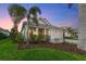 Charming one-story home with landscaped yard and white exterior at 883 Seascape Pl, Sarasota, FL 34240