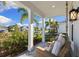 Relaxing front porch with comfortable seating and view of the neighborhood at 883 Seascape Pl, Sarasota, FL 34240