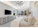 Relaxing main bedroom with a king-size bed and large windows at 883 Seascape Pl, Sarasota, FL 34240