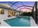 Resort-style pool and spa with covered patio area at 883 Seascape Pl, Sarasota, FL 34240