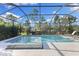 Enclosed pool and spa with a tranquil view at 883 Seascape Pl, Sarasota, FL 34240