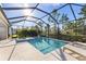 Enjoy this screened pool and spa with a spacious patio at 883 Seascape Pl, Sarasota, FL 34240