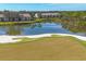 Golf course and lakefront community view at 8901 Veranda Way # 116, Sarasota, FL 34238