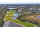 Aerial view of community with golf course and water features at 8901 Veranda Way # 116, Sarasota, FL 34238