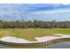 Golf course with sand traps and water at 8901 Veranda Way # 116, Sarasota, FL 34238