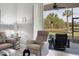 Relaxing living room with view of tranquil water at 8901 Veranda Way # 116, Sarasota, FL 34238