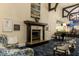 Elegant lobby with fireplace and piano at 8901 Veranda Way # 116, Sarasota, FL 34238