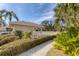 Community pool with adjacent patio and lush landscaping at 8901 Veranda Way # 116, Sarasota, FL 34238