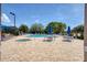 Resort-style pool with lounge chairs and tables at 8901 Veranda Way # 116, Sarasota, FL 34238