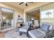 Spacious screened patio with comfortable seating and views of the golf course at 8901 Veranda Way # 116, Sarasota, FL 34238