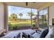 Relaxing screened patio overlooking a pond and lush landscape at 8901 Veranda Way # 116, Sarasota, FL 34238