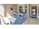 Condo screened porch with patio furniture at 8901 Veranda Way # 116, Sarasota, FL 34238