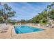 Inviting community swimming pool with plenty of lounge chairs at 8901 Veranda Way # 116, Sarasota, FL 34238