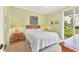 Main bedroom with king-size bed, access to a balcony and a dresser at 9620 Club South Cir # 5102, Sarasota, FL 34238