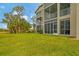 Building exterior showcases lush landscaping at 9620 Club South Cir # 5102, Sarasota, FL 34238