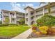 Two-story condo building with landscaped grounds and walkway at 9620 Club South Cir # 5102, Sarasota, FL 34238