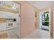 White kitchen with appliances and breakfast bar at 9620 Club South Cir # 5102, Sarasota, FL 34238