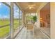 Bright sunroom boasts glass walls and outdoor views at 9620 Club South Cir # 5102, Sarasota, FL 34238