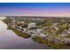 Aerial view of waterfront home and neighborhood at 10106 46Th W Ave, Bradenton, FL 34210
