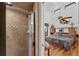 Bathroom with a shower and view into bedroom at 10106 46Th W Ave, Bradenton, FL 34210