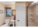 Small bathroom with pedestal sink and shower at 10106 46Th W Ave, Bradenton, FL 34210