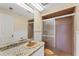 Bathroom with granite countertop and shower at 10106 46Th W Ave, Bradenton, FL 34210