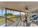 Spacious deck overlooking the water with patio furniture and ceiling fan at 10106 46Th W Ave, Bradenton, FL 34210