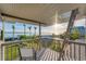 Deck overlooking the water with seating and ladder access at 10106 46Th W Ave, Bradenton, FL 34210