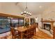 Spacious dining room with hardwood floors, fireplace, and water views at 10106 46Th W Ave, Bradenton, FL 34210