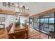 Bright dining room with hardwood floors and a view of the water at 10106 46Th W Ave, Bradenton, FL 34210