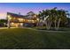 Two-story waterfront home with backyard and palm trees at 10106 46Th W Ave, Bradenton, FL 34210