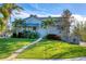 Two-story waterfront home with lush landscaping at 10106 46Th W Ave, Bradenton, FL 34210