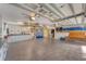 Large garage with overhead storage and workbenches at 10106 46Th W Ave, Bradenton, FL 34210
