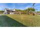Elevated home with large yard and tropical landscaping at 10106 46Th W Ave, Bradenton, FL 34210