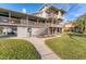 Two-story home with wraparound deck and landscaped yard at 10106 46Th W Ave, Bradenton, FL 34210