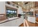 Bright kitchen with granite countertops and white cabinets, offering water views at 10106 46Th W Ave, Bradenton, FL 34210