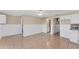 Open kitchen with white cabinets and tiled floor at 10106 46Th W Ave, Bradenton, FL 34210