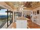 Kitchen island with granite countertop, open to dining area with water views at 10106 46Th W Ave, Bradenton, FL 34210