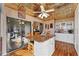 Island kitchen with granite counters and tin ceiling at 10106 46Th W Ave, Bradenton, FL 34210