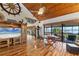 Living room with hardwood floors, vaulted wood ceiling and water views at 10106 46Th W Ave, Bradenton, FL 34210