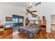 Main bedroom with water views, ceiling fan, and hardwood floors at 10106 46Th W Ave, Bradenton, FL 34210