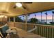 Covered porch overlooking waterfront with sunset view at 10106 46Th W Ave, Bradenton, FL 34210