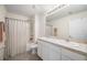 Well-appointed bathroom with double sinks and shower/tub combo at 10210 Mangrove Well Rd, Sun City Center, FL 33573