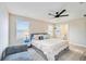 Spacious bedroom with king-size bed and en-suite bathroom at 10210 Mangrove Well Rd, Sun City Center, FL 33573