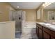 Main bathroom with double sinks and shower at 1026 Seminole Sky Dr, Ruskin, FL 33570