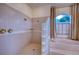 Large walk-in shower with tiled walls and a separate soaking tub at 10523 Cheval Pl, Lakewood Ranch, FL 34202