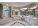 Spacious Primary bathroom with double sinks, soaking tub, and separate shower at 10523 Cheval Pl, Lakewood Ranch, FL 34202