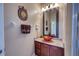 Bathroom features granite countertop, vessel sink, and updated fixtures at 10523 Cheval Pl, Lakewood Ranch, FL 34202