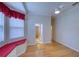 Bedroom featuring a bay window, built-in window seat, and hardwood floors at 10523 Cheval Pl, Lakewood Ranch, FL 34202